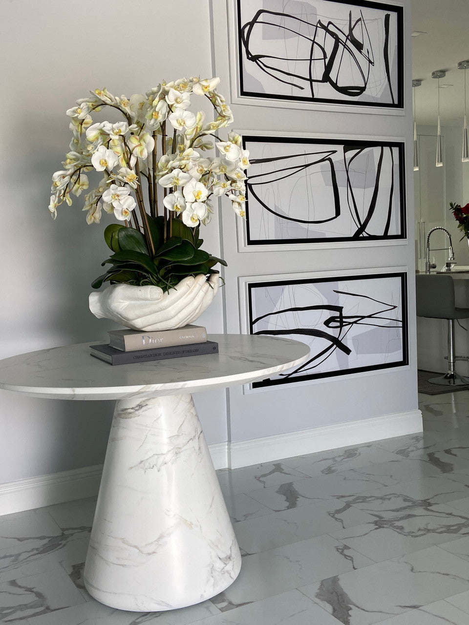 White Phalaenopsis Orchids in White Open Hands Sculpture Vase