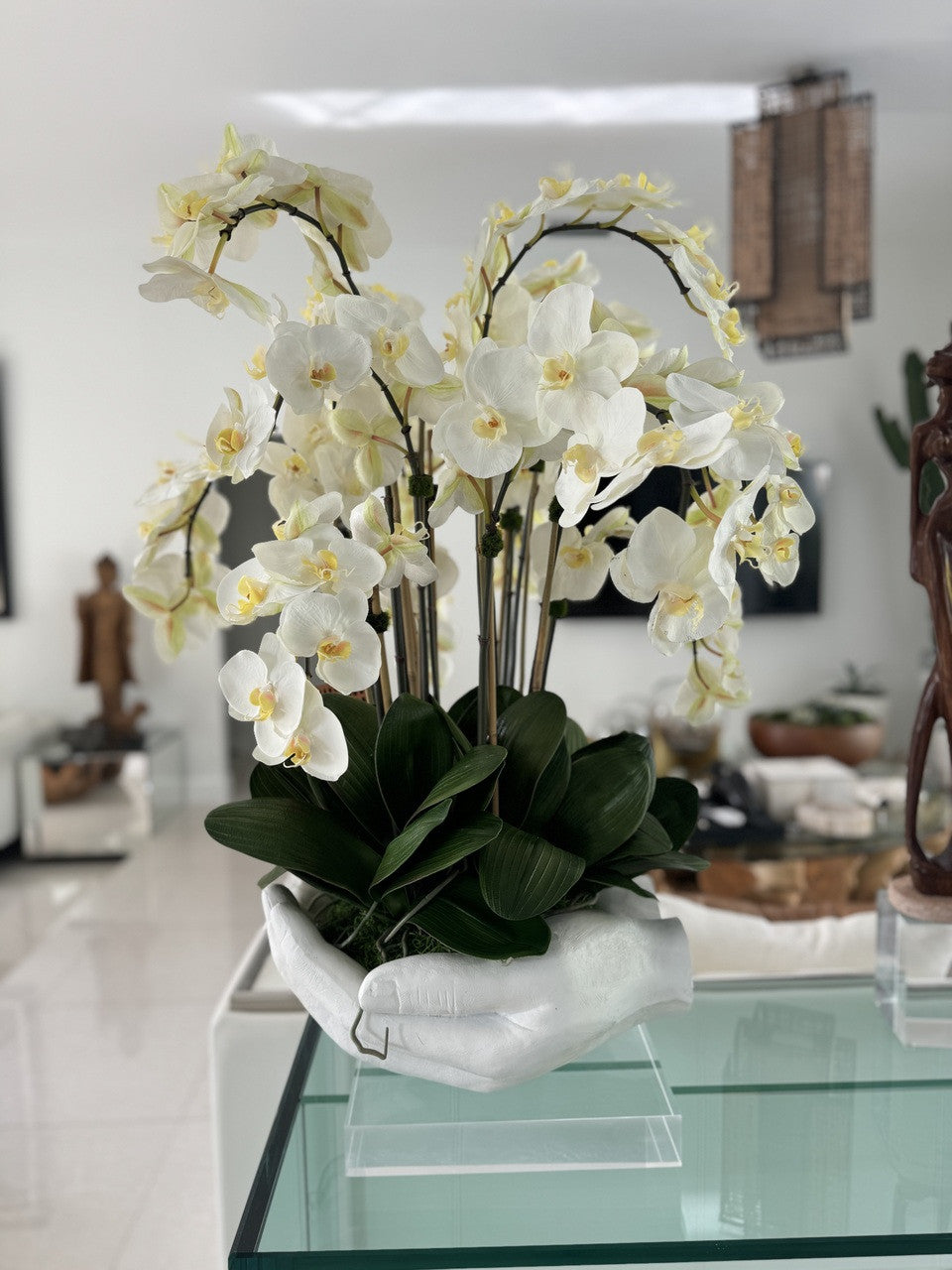 White Phalaenopsis Orchids in White Open Hands Sculpture Vase