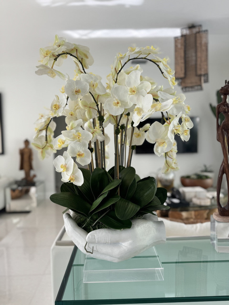 White Phalaenopsis Orchids in White Open Hands Sculpture Vase