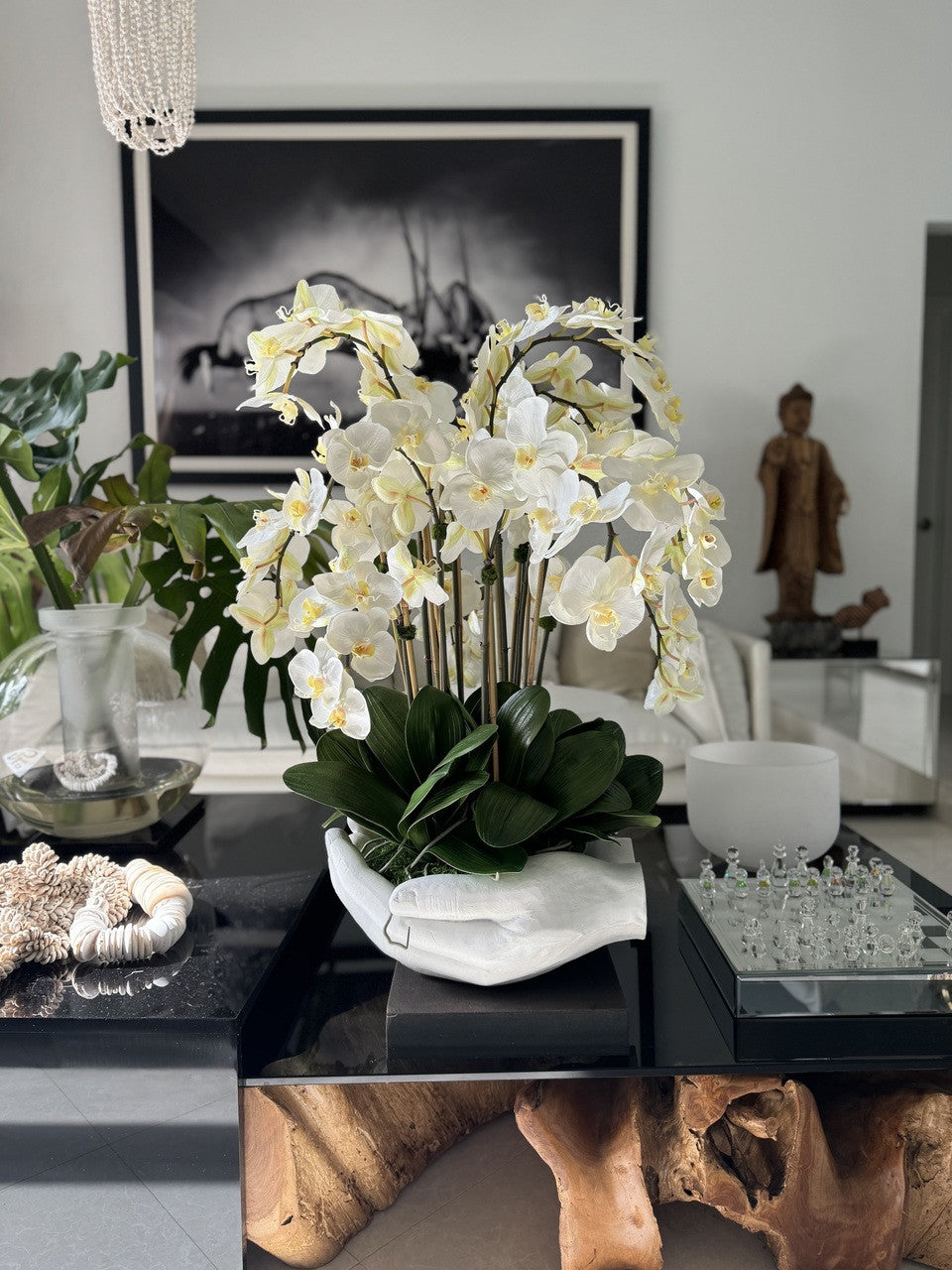 White Phalaenopsis Orchids in White Open Hands Sculpture Vase