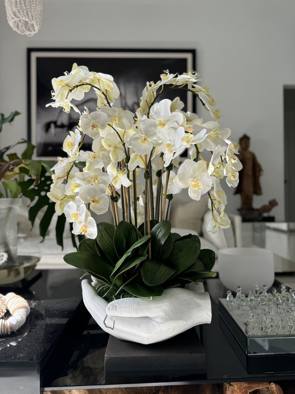 White Phalaenopsis Orchids in White Open Hands Sculpture Vase