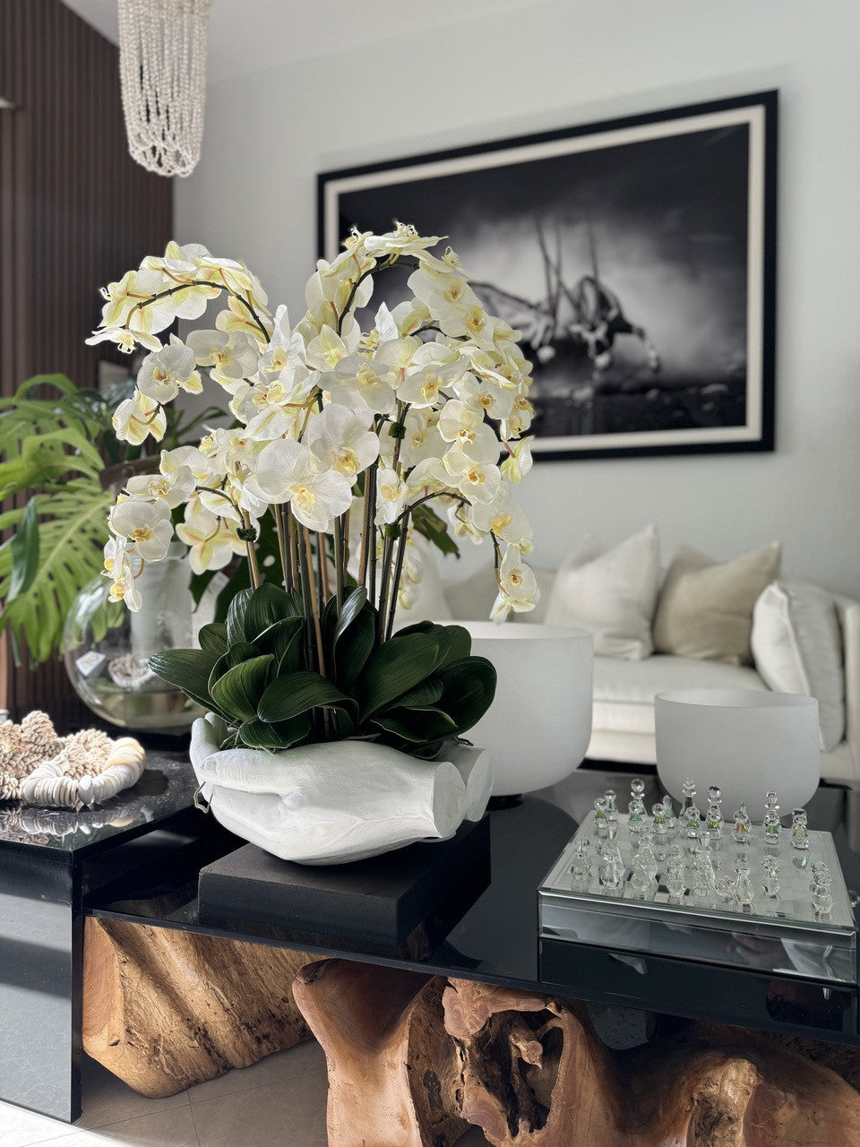 White Phalaenopsis Orchids in White Open Hands Sculpture Vase