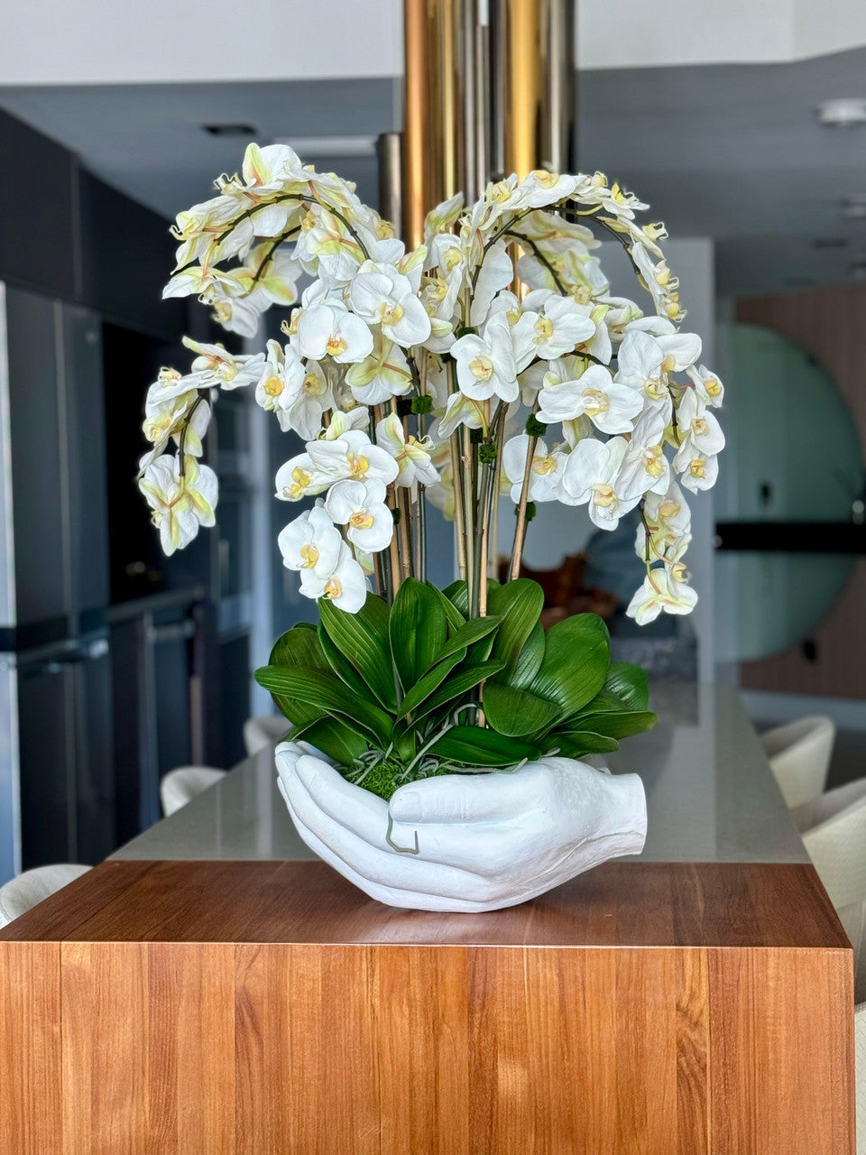 White Phalaenopsis Orchids in White Open Hands Sculpture Vase