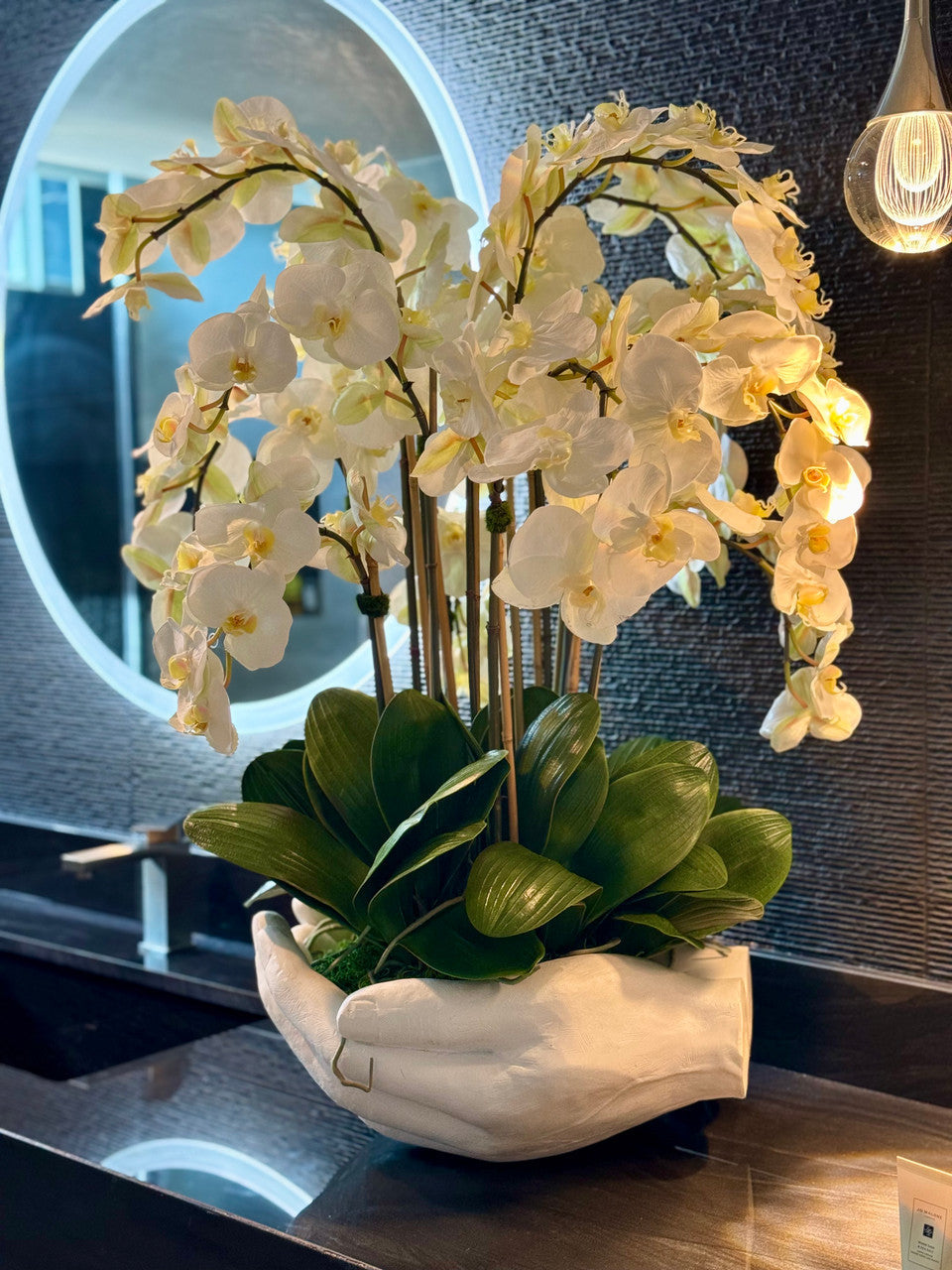 White Phalaenopsis Orchids in White Open Hands Sculpture Vase