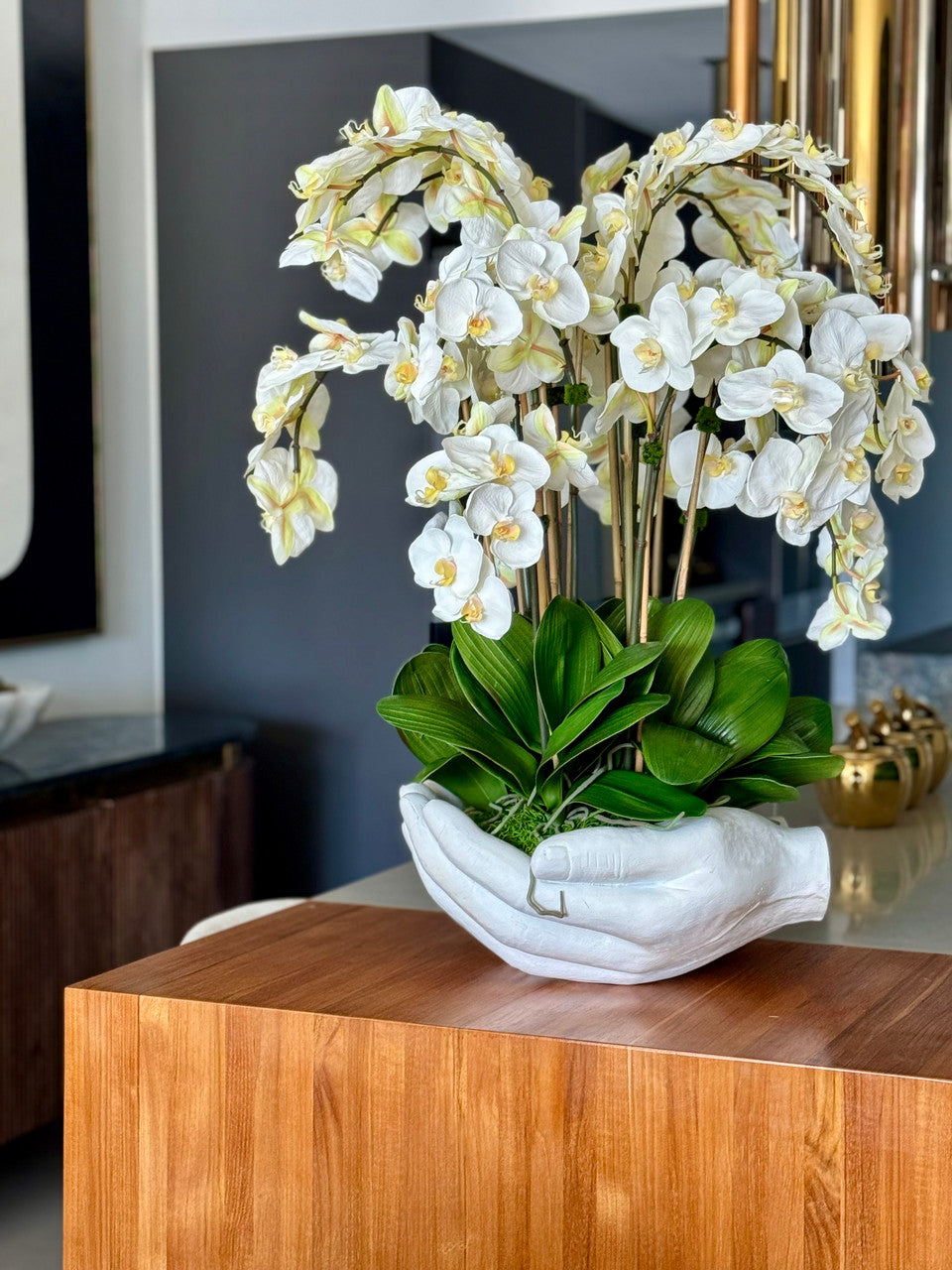 White Phalaenopsis Orchids in White Open Hands Sculpture Vase